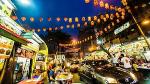 A bustling street market at night with food stalls and lanterns. - A Stylish 2BR Home, 5min Walk to Klcc (Kuala Lumpur)