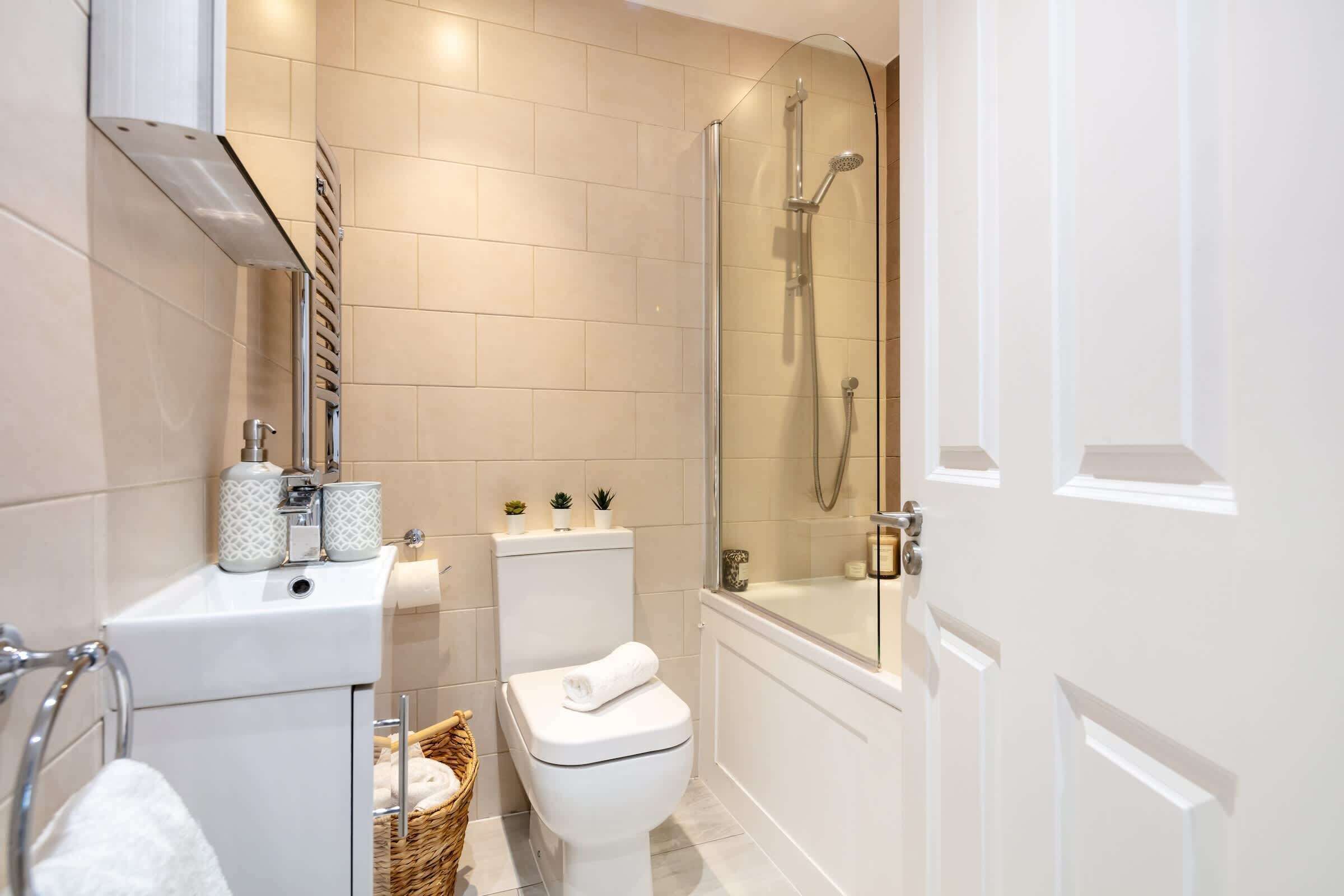 Shower, hair dryer, towels, shampoo