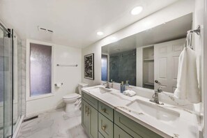 Shower, hair dryer, towels, soap
