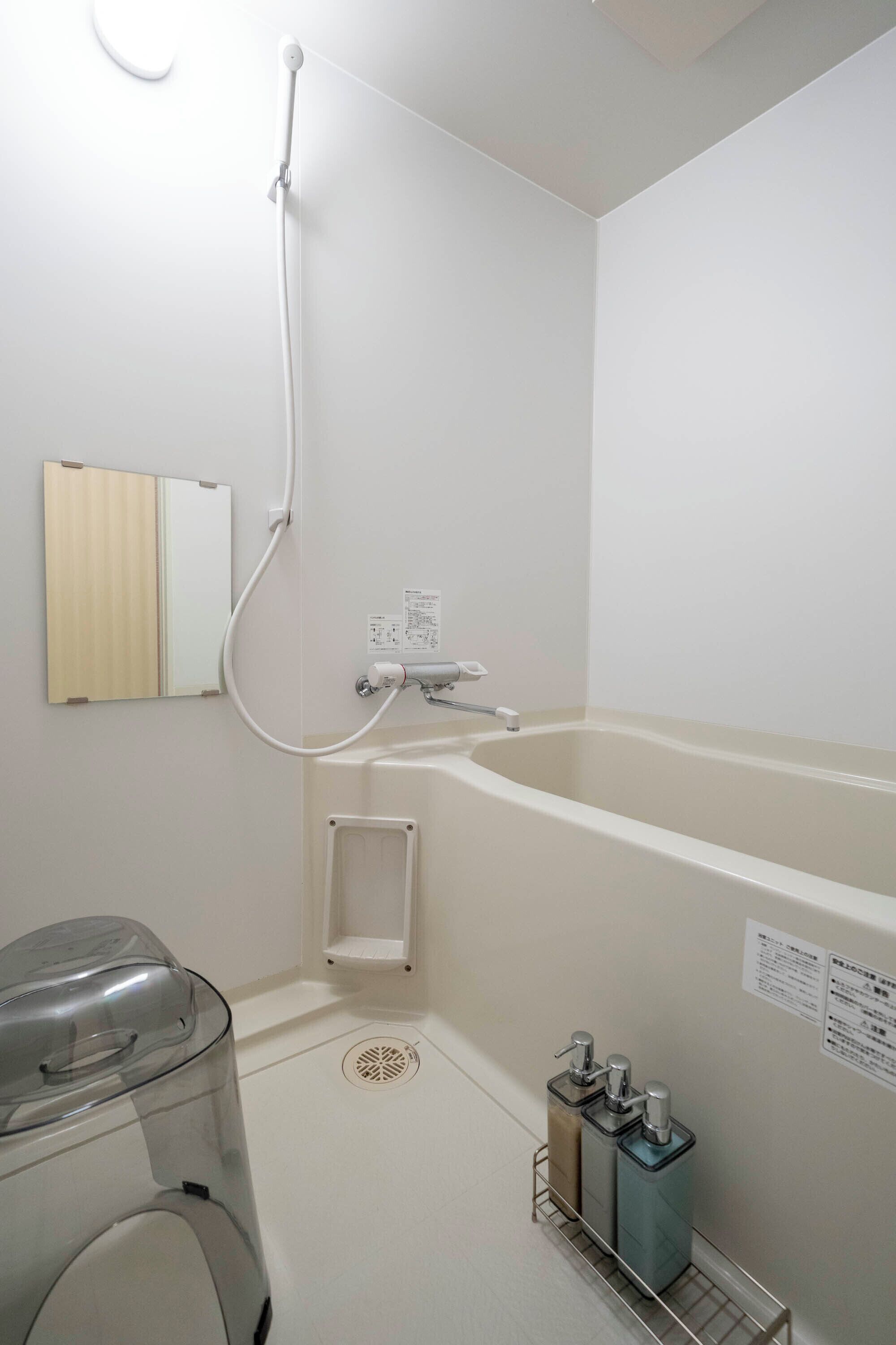 Combined shower/tub, free toiletries, hair dryer, slippers