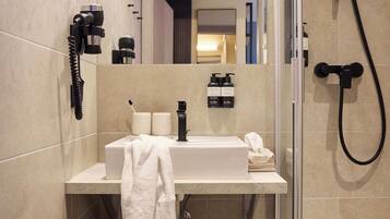 Shower, designer toiletries, hair dryer, bathrobes