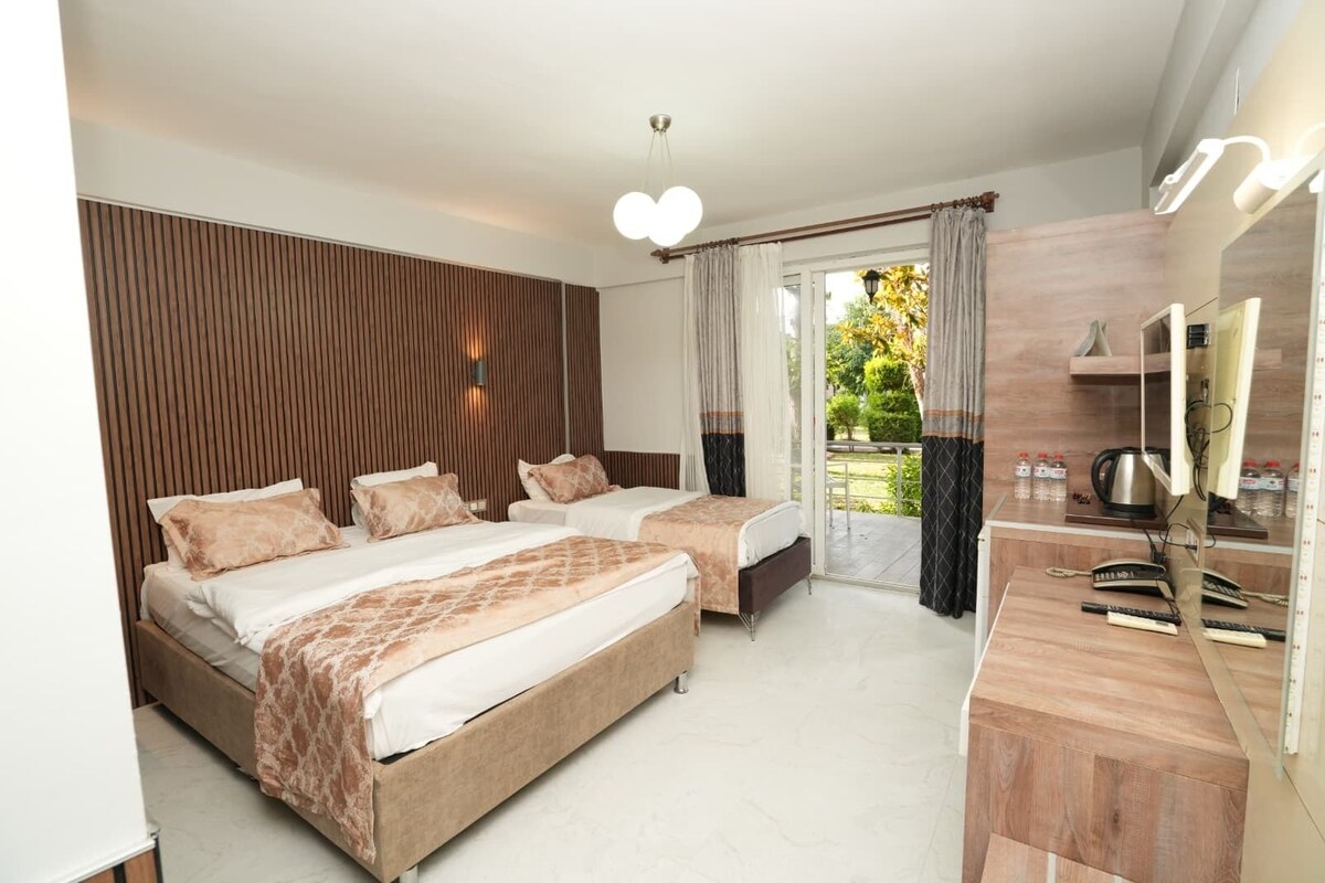 Family Quadruple Room, Balcony, Garden View | WiFi (free), bed sheets