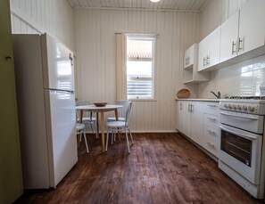 Fridge, microwave, oven, stovetop - Stylish 3-Bed Home | Spacious & Central (Brisbane)