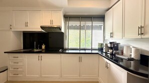 Fridge, microwave, stovetop, coffee/tea maker
