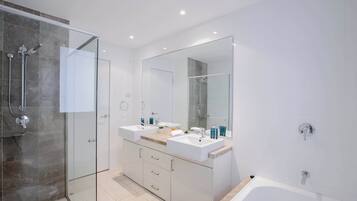 Shower, hair dryer, towels, shampoo