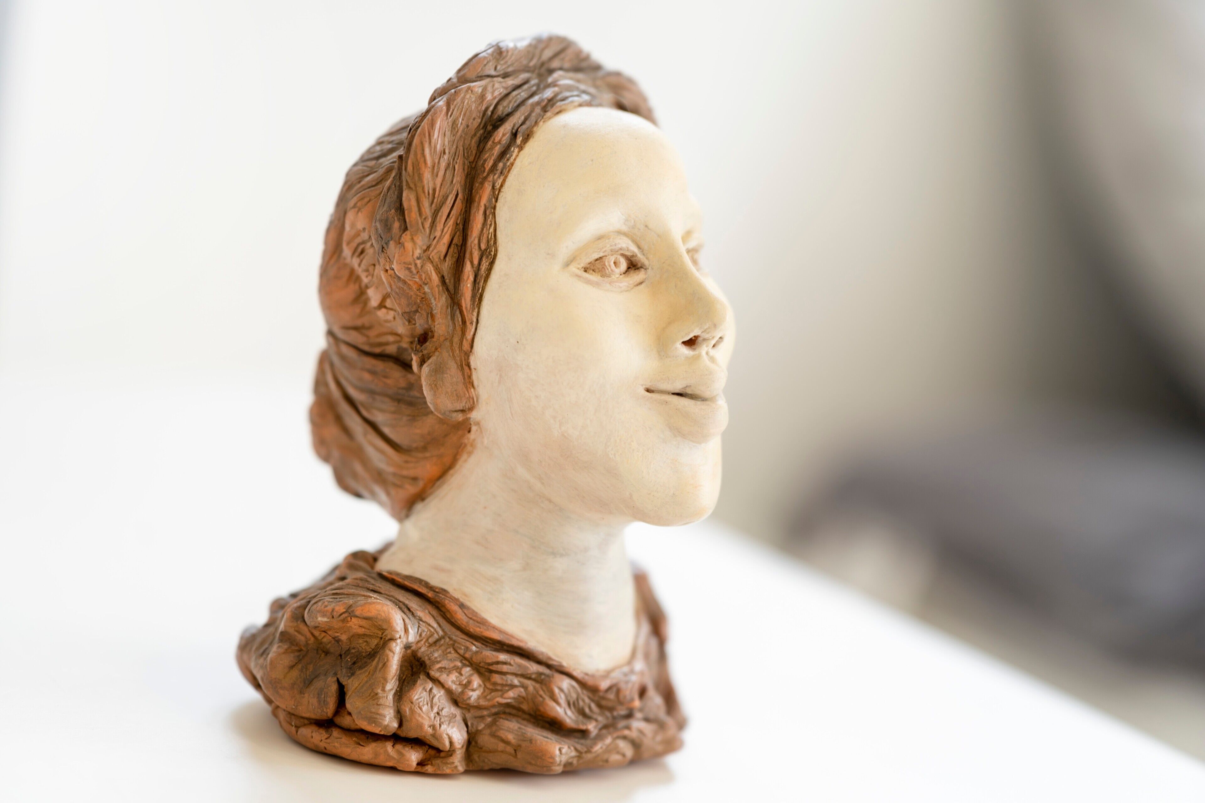 A bust sculpture with intricate detailing.