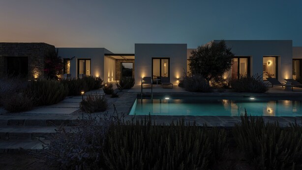 A modern house with a swimming pool, stone walls, and outdoor seating. - Ampelas 4BR Villa, Private Pool, To Ktima Paros (Paros)