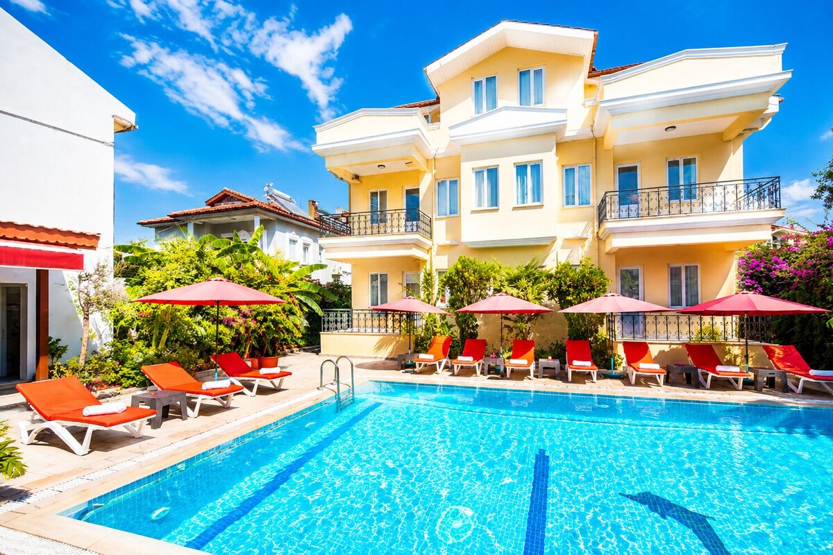 Apartment, Balcony, Courtyard View | Pool | Seasonal outdoor pool, open 9:30 AM to 8:00 PM, pool umbrellas