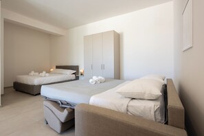 Deluxe Studio, Garden Area | Blackout drapes, free WiFi