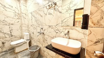 Shower, rainfall showerhead, bidet, towels