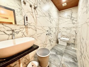 Shower, rainfall showerhead, bidet, towels