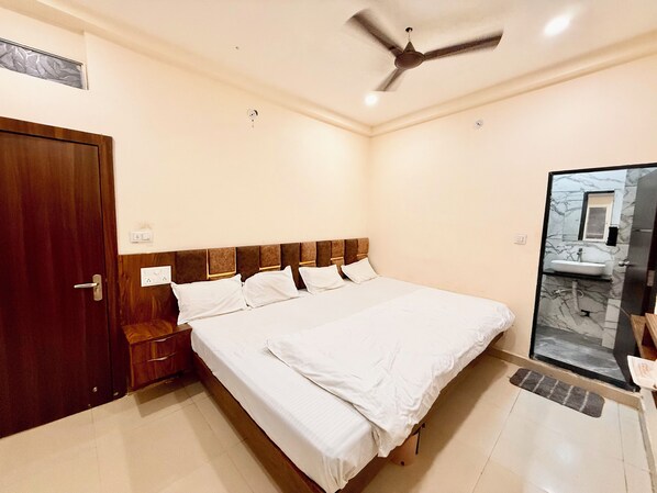 Premium bedding, desk, laptop workspace, free WiFi