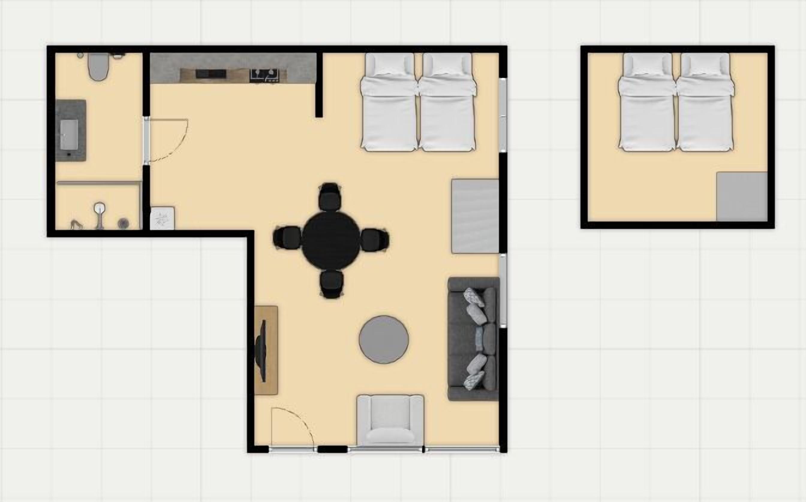 Indeling van een hotelkamer met een zithoek, een bank, een ronde tafel en een bed.