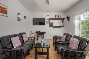 Family House, Multiple Bedrooms, 2 Bathrooms (Holiday Home with Pool near Makarsk) | Living area | 21-inch flat-screen TV with satellite channels, fireplace - Holiday Home With Pool Near Makarsk (Proložac)