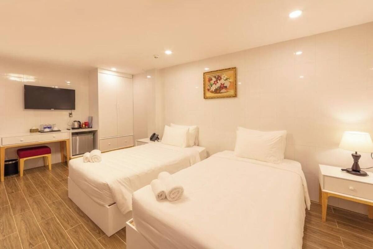 Chambre Deluxe Double ou avec lits jumeaux | Bureau, rideaux occultants, fer et planche à repasser, Wi-Fi gratuit