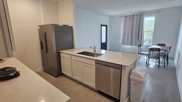 Fridge, microwave, dishwasher, cookware/dishes/utensils