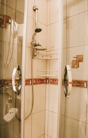 Shower, hair dryer, towels, toilet paper