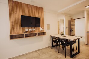 Deluxe Apartment, 1 Bedroom, Balcony, City View | Living area | 43-inch Smart TV with digital channels