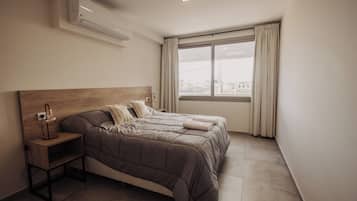 Deluxe Apartment, 2 Bedrooms, Balcony, City View | Blackout drapes, soundproofing, free WiFi, wheelchair access