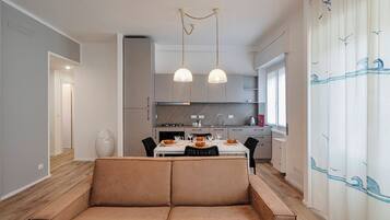 Apartment, 1 Queen Bed with Sofa bed | Living area | 30-inch TV with satellite channels