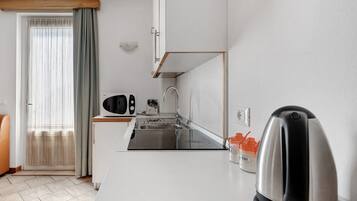 Fridge, stovetop, cookware/dishes/utensils