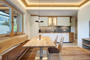 Fridge, stovetop, dishwasher, coffee/tea maker