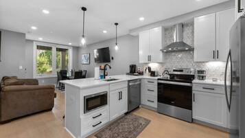 Coffee/tea maker, fridge, microwave, oven