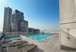 Outdoor pool - Blossoming 1BR Walk to Dubai Mall & Pool (Dubai)