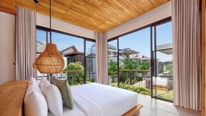 A modern bedroom with a large bed, wooden ceiling, and large windows offering a view of greenery and buildings.
