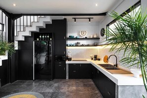 Fridge, microwave, stovetop, coffee/tea maker