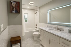 Shower, towels, soap, toilet paper