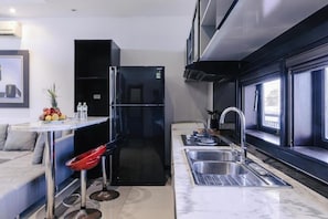 Desk, laptop workspace, blackout curtains, iron/ironing board