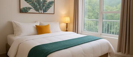 A neatly made bed with white and green bedding, a yellow pillow, and a framed plant artwork above it.