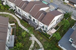 A residential building with a hipped roof, multiple balconies, and a curved driveway. - GardenView Home in Sungai Petani (fit 6 pax) (Sungai Petani)