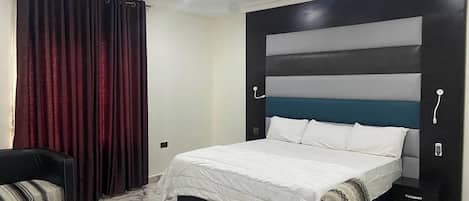 Family Apartment, Balcony, City View | In-room safe, desk, laptop workspace, blackout drapes