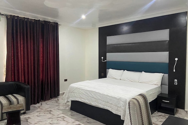 Family Apartment, Balcony, City View | In-room safe, desk, laptop workspace, blackout drapes