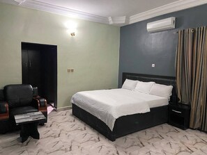 Family Apartment, Balcony, City View | In-room safe, desk, laptop workspace, blackout drapes
