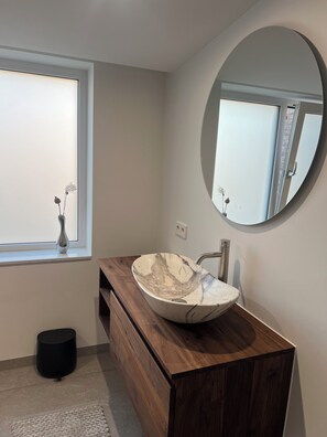 Shower, hair dryer, towels, toilet paper