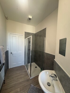 Shower, hair dryer, towels, toilet paper