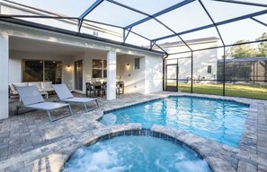 Outdoor pool, a heated pool - Luxury Solara Home • Heated Pool & Spa • Sleeps 12 • Near Disney ✅ (Kissimmee)