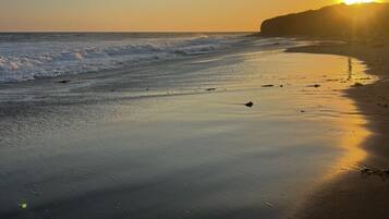 On the beach, sun loungers, beach towels