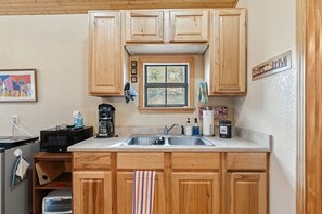 Microwave, coffee/tea maker, toaster, cookware/dishes/utensils