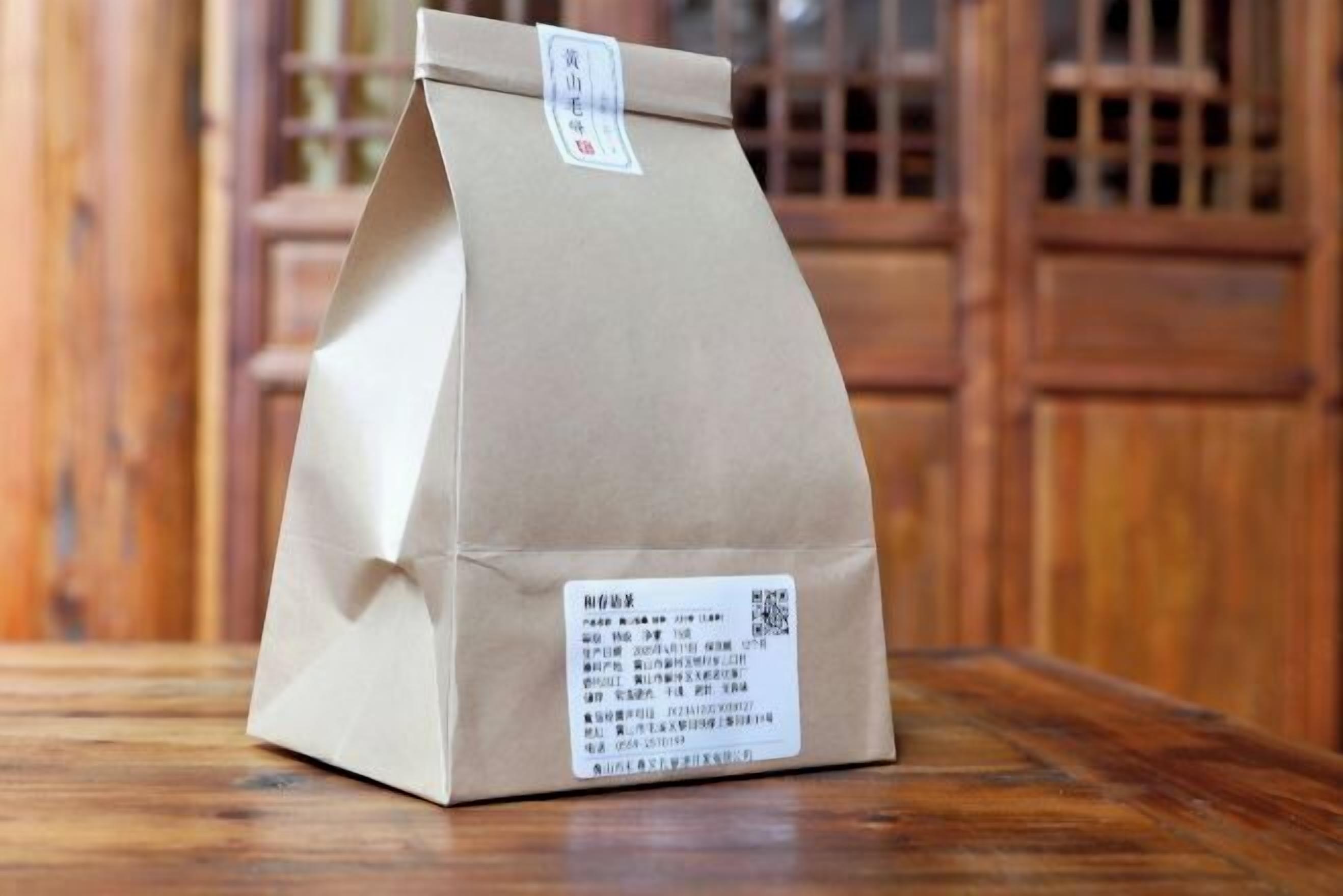 A paper bag with a label on a wooden surface.