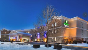 A Holiday Inn Express building with a brick facade, large windows, and a well-lit entrance. - Charming hotel with 2 Queen Beds in delightful Harrisburg with AC, fitness room (Harrisburg)