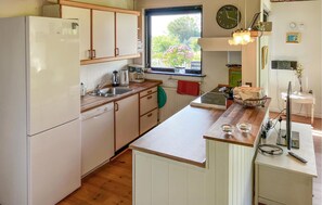 Fridge, stovetop, dishwasher, coffee/tea maker