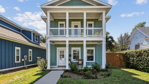 A two-story house with a front porch, a mailbox, and a number '1921' on the door. - Pet Friendly East Hill New Build - Walk to Graffiti Bridge - Close to Downtown and Pensacola Beach (Pensacola)