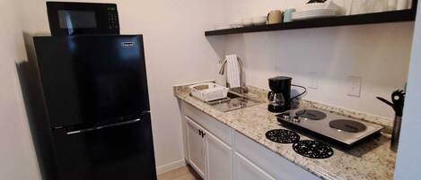 Fridge, microwave, stovetop, coffee/tea maker