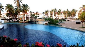Outdoor pool, open 9:00 AM to 9:00 PM, pool loungers
