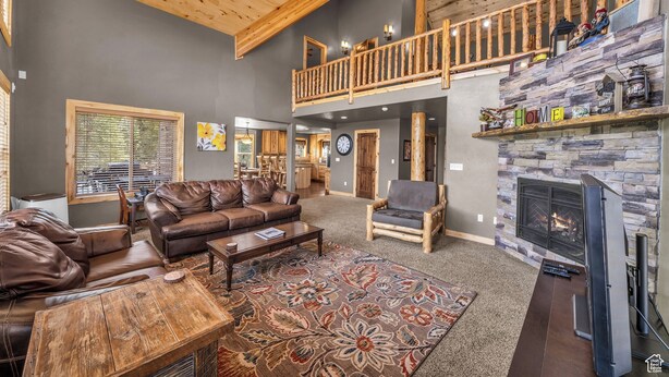 A spacious living room with a high ceiling, a fireplace, and a balcony. - The Lost Creek Lodge - A Perfect Escape for Families, Reunions, and Friends. (Duck Creek Village)