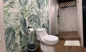 Shower, hair dryer, towels, toilet paper